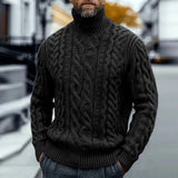 Black cable knit turtleneck sweater with twisted braided pattern, ribbed collar and hem.