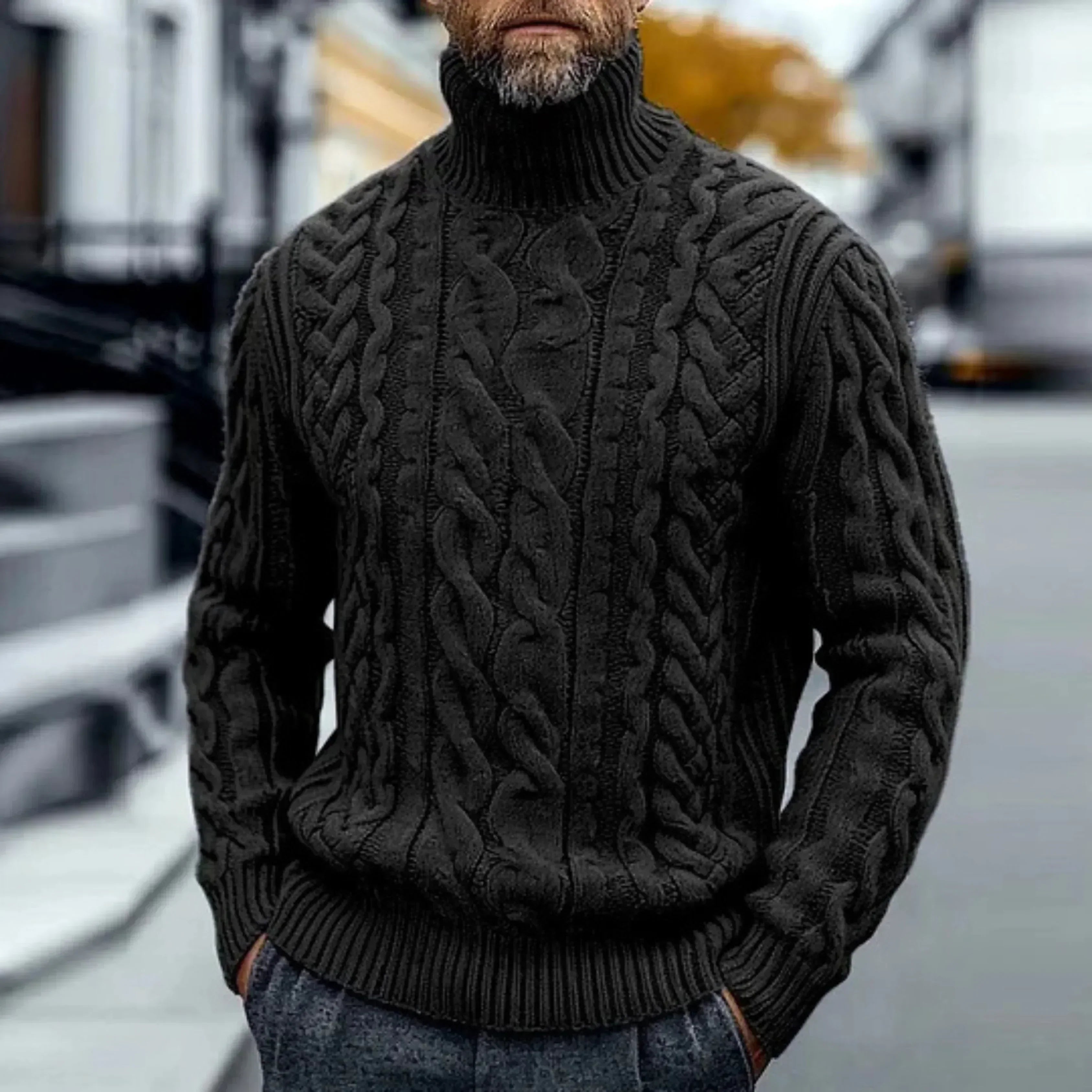 Black cable knit turtleneck sweater with twisted braided pattern, ribbed collar and hem.