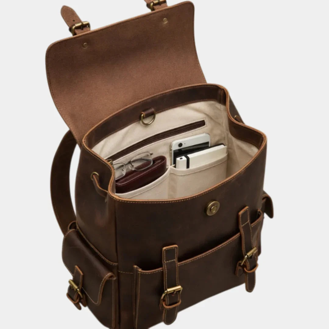 Dark brown leather backpack open view with inner storage for small items