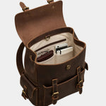 Dark brown leather backpack open view with inner storage for small items