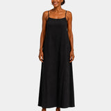 Black long dress with thin spaghetti straps, sleeveless and flowing.