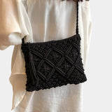 Black woven shoulder bag with textured front and braided strap