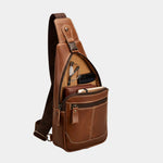 Brown leather chest bag with front zip pocket and side zip details