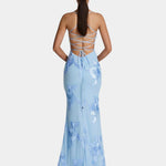 Backless maxi dress with crisscross straps and floral print