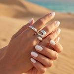 Silver open oval ring set with two stacked bands on hands, adjustable size