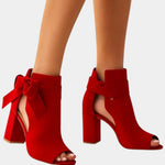 Ruby red heeled sandals with peep toe, ankle bow, and block heel