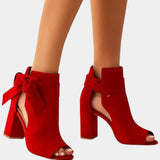 Ruby red heeled sandals with peep toe, ankle bow, and block heel