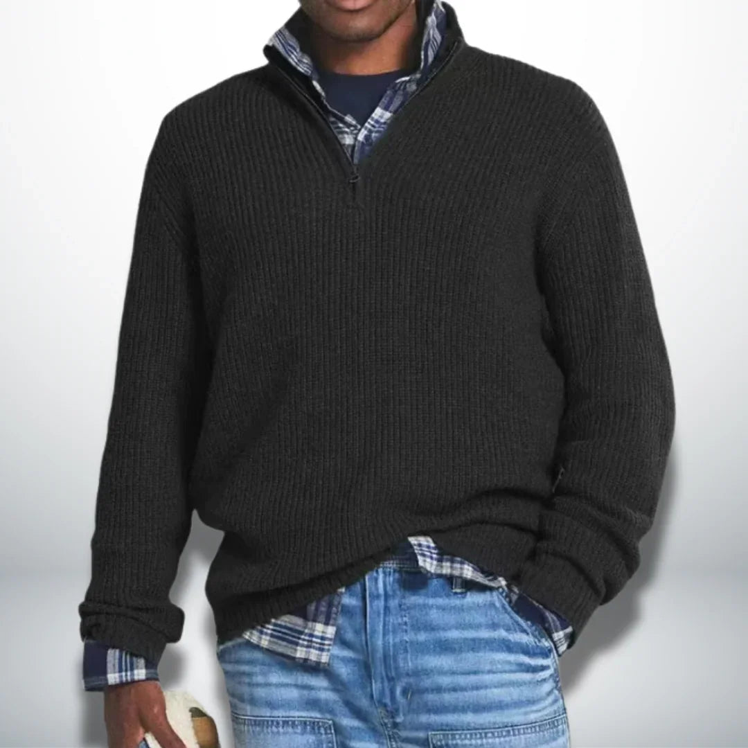 Black knit quarter-zip sweater with ribbed cuffs and hem.