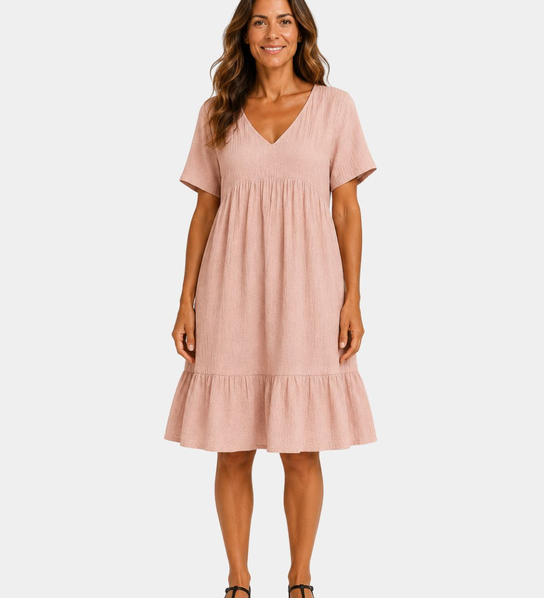 Light pink textured V-neck midi dress with short sleeves and tiered skirt