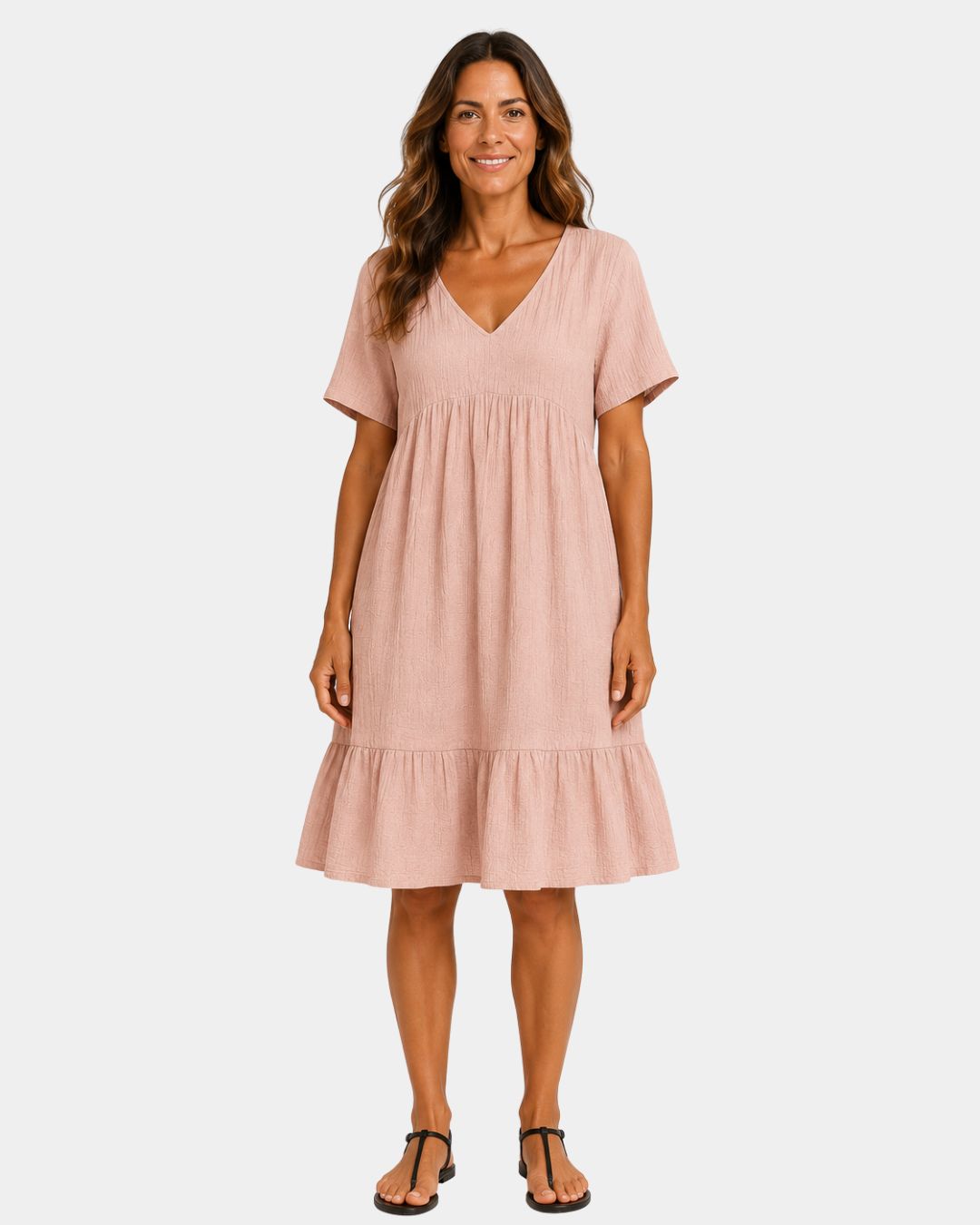 Light pink textured V-neck midi dress with short sleeves and tiered skirt