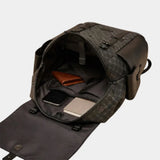 Leather backpack open at top, showing interior pockets and organizer compartments