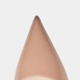 Beige pointed-toe slingback heel showing smooth upper and stitched trim at opening