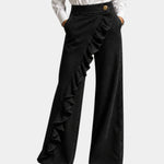 Black ruffle-front wide-leg denim pants with gold button closure