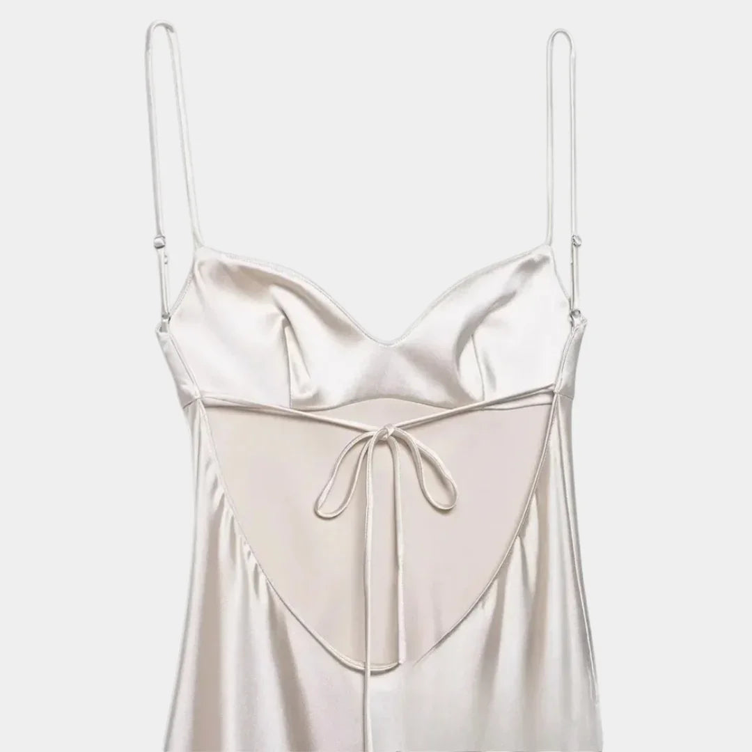 Women's white satin slip dress with spaghetti straps and center tie detail