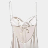 Women's white satin slip dress with spaghetti straps and center tie detail