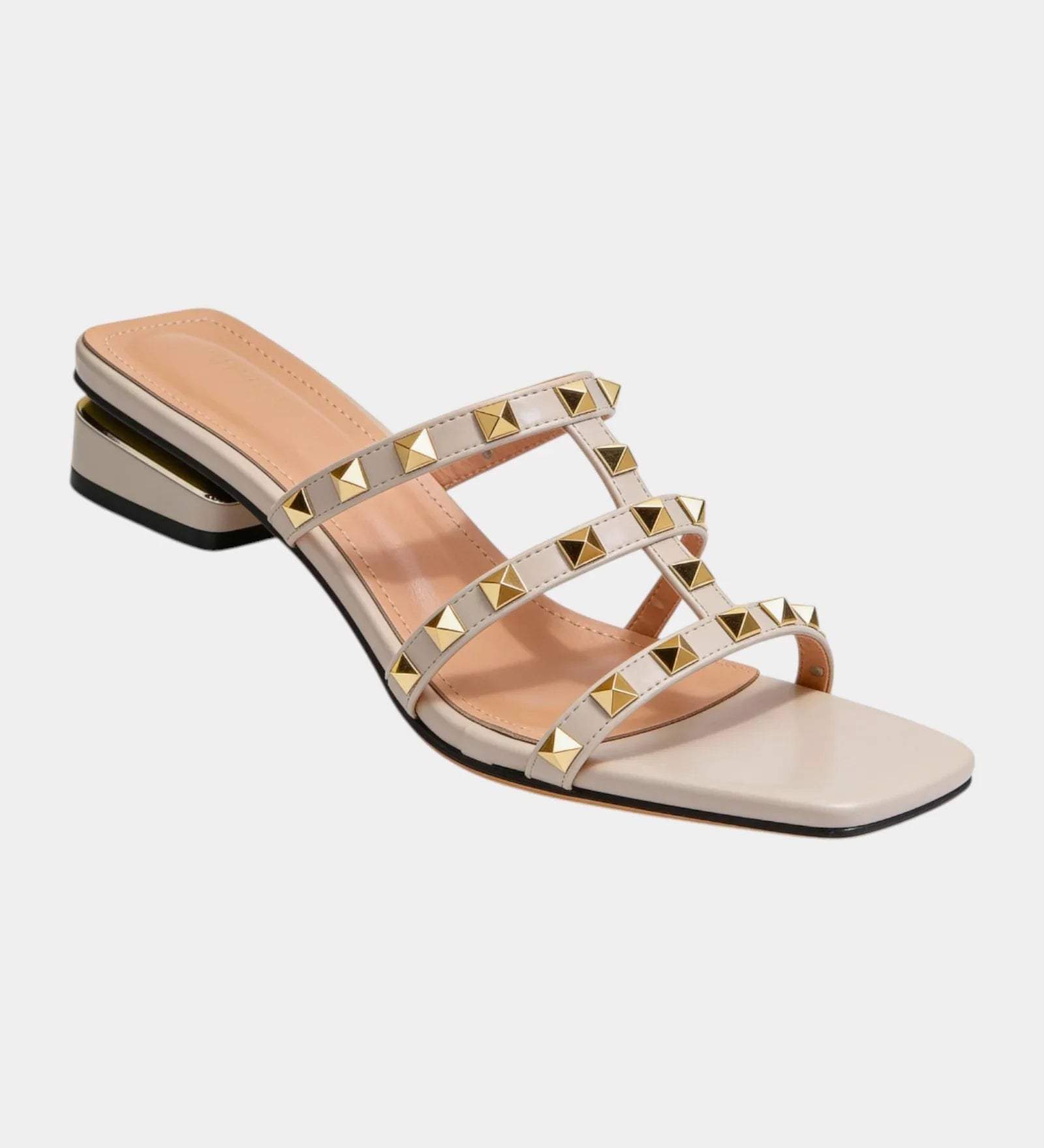 Cream studded slide sandals with crisscross straps and gold square studs