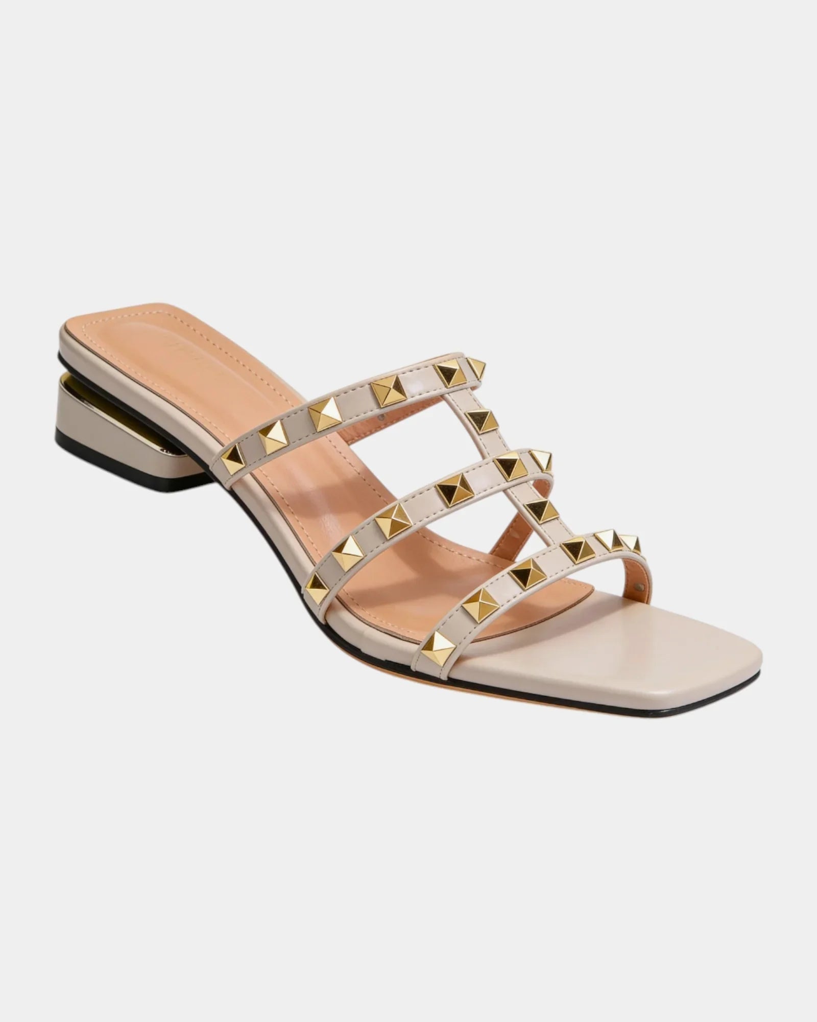 Cream studded slide sandals with crisscross straps and gold square studs