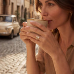 Gold ring set on a woman's hand