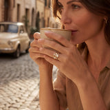 Gold ring set on a woman's hand