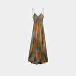 Abstract printed maxi dress with V-neck spaghetti straps, teal and rust tones, front view