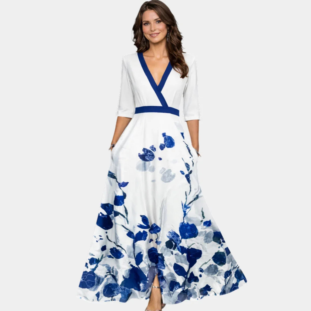 Floral maxi dress with V-neck, blue trim, waist tie, and 3/4 sleeves