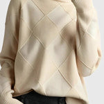 Ivory turtleneck sweater with ribbed cuffs and diamond knit pattern on sleeves