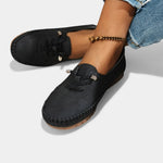 Black suede lace-up loafers with stitched moc toe and low profile sole.