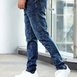 Dark blue casual stretch jeans with straight fit and visible pocket stitching