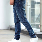 Dark blue casual stretch jeans with straight fit and visible pocket stitching