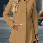 Camel button-front daily jacket with long sleeves and stand collar.