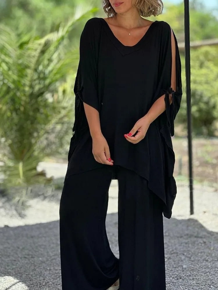 Black V-neck draped tunic with tie sleeves and wide-leg pants