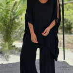 Black V-neck draped tunic with tie sleeves and wide-leg pants
