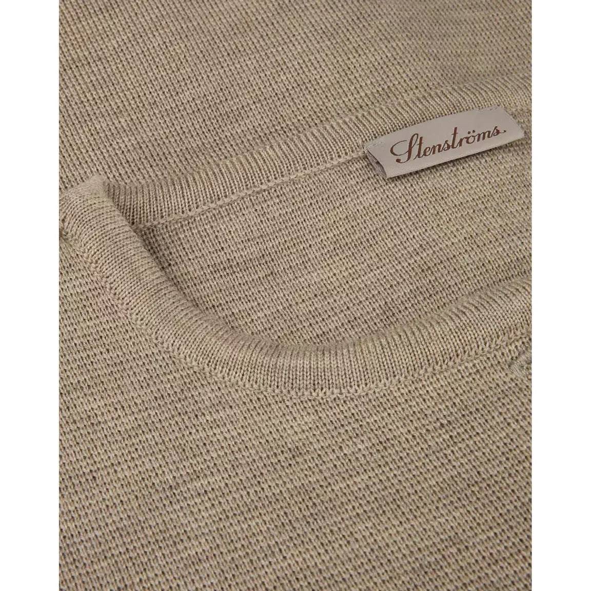 Beige merino wool cardigan neckline with ribbed trim and brand label