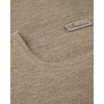 Beige merino wool cardigan neckline with ribbed trim and brand label