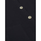 Black merino wool cardigan close-up with two gold snap buttons
