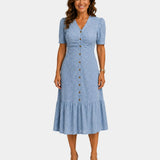 Lightweight shirt dress in light blue, short sleeves, button front, tiered skirt hem.