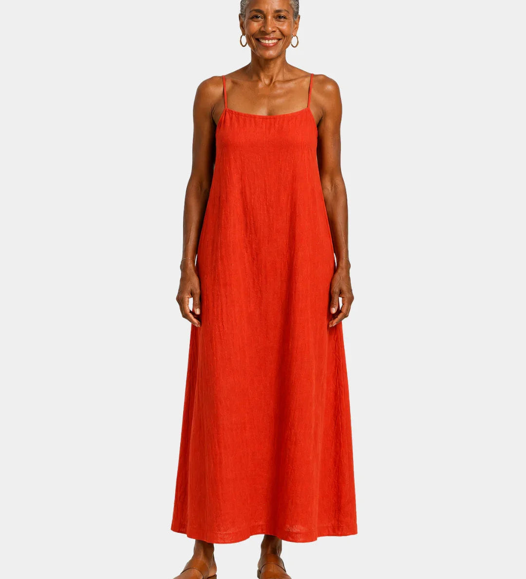 Red long dress with thin spaghetti straps, sleeveless and relaxed fit.