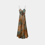 Abstract printed maxi dress with V-neck spaghetti straps and gathered waist, teal and rust