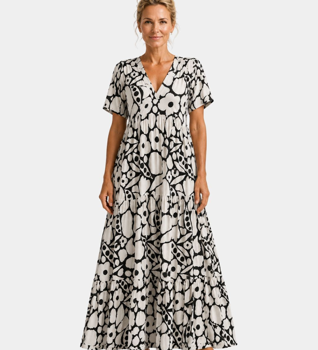 Black and white floral maxi dress with V-neck, short sleeves, and tiered skirt