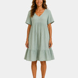 Light green textured V-neck midi dress with short sleeves and tiered skirt