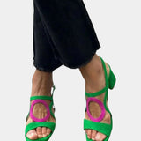 Green square-toe sandals with rounded cutout straps and block-heel look