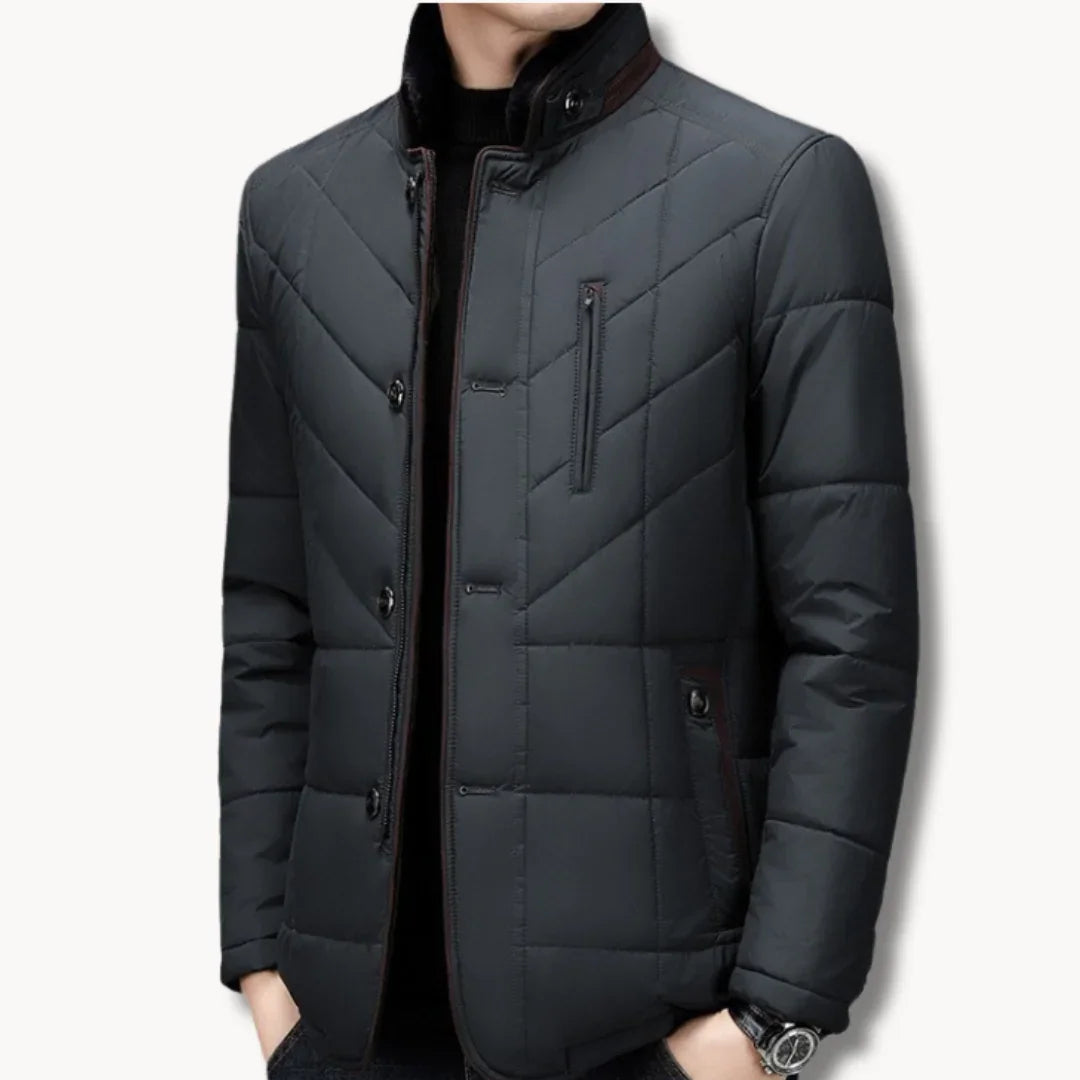 Dark quilted winter jacket with stand collar, front snaps, and side chest pocket
