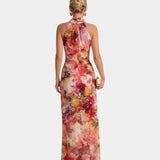 Back view of floral halter maxi dress with halter neck and long skirt