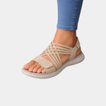 Beige knit orthopedic sandals with open toe and crisscross straps, cushioned sole