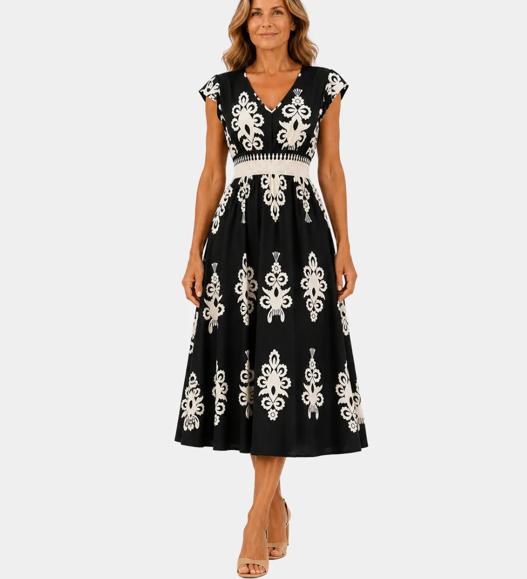 Black baroque-inspired midi dress with white ornate embroidery, V-neck, cap sleeves, belt
