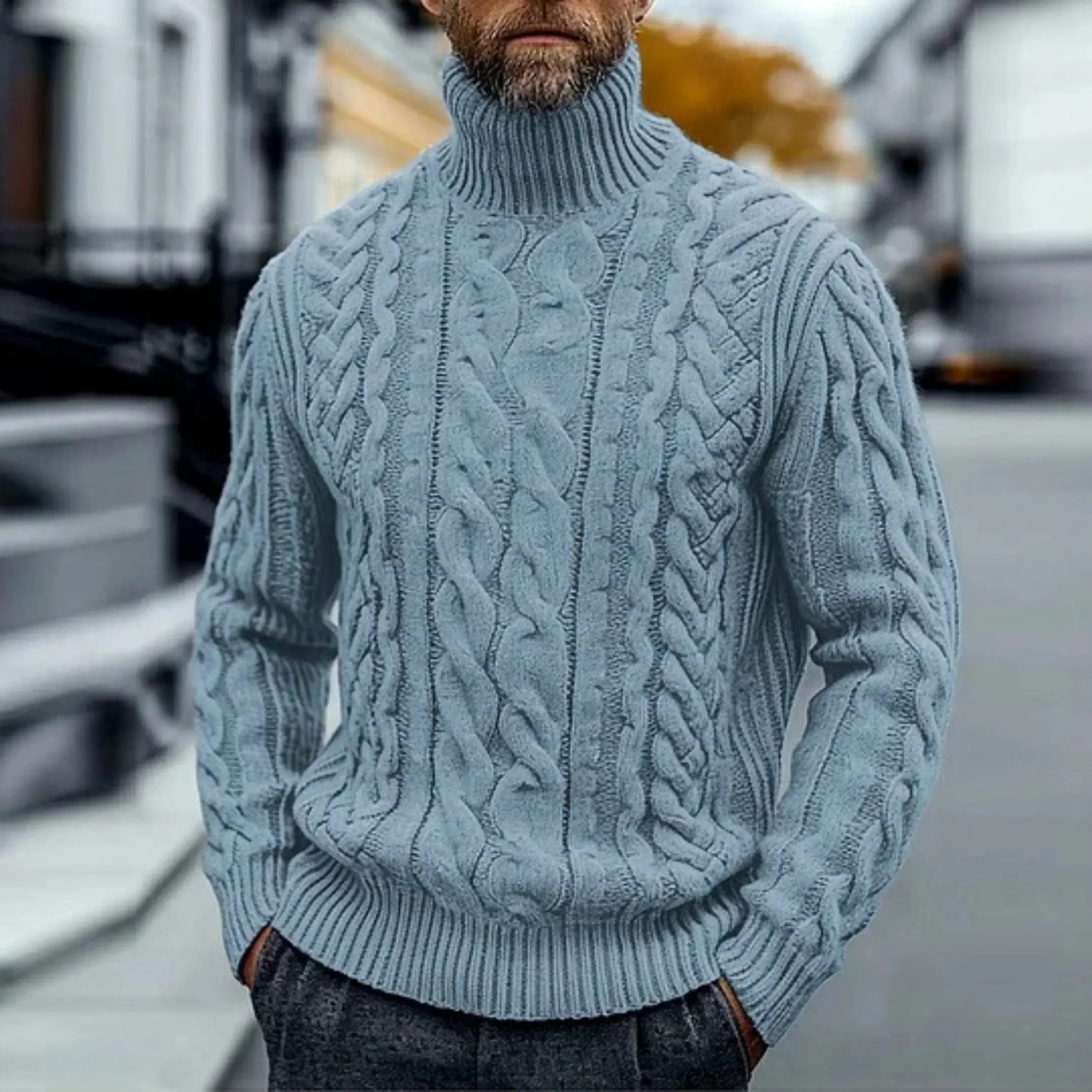 Light blue cable knit turtleneck sweater with twisted braided texture and ribbed hem.