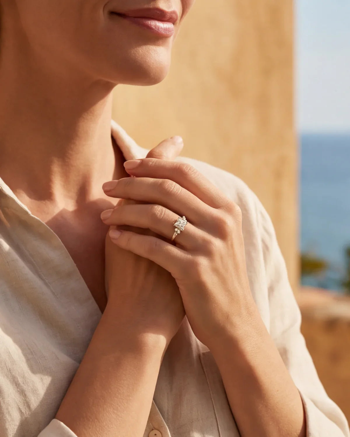 Gold ring with clear cluster stone on finger