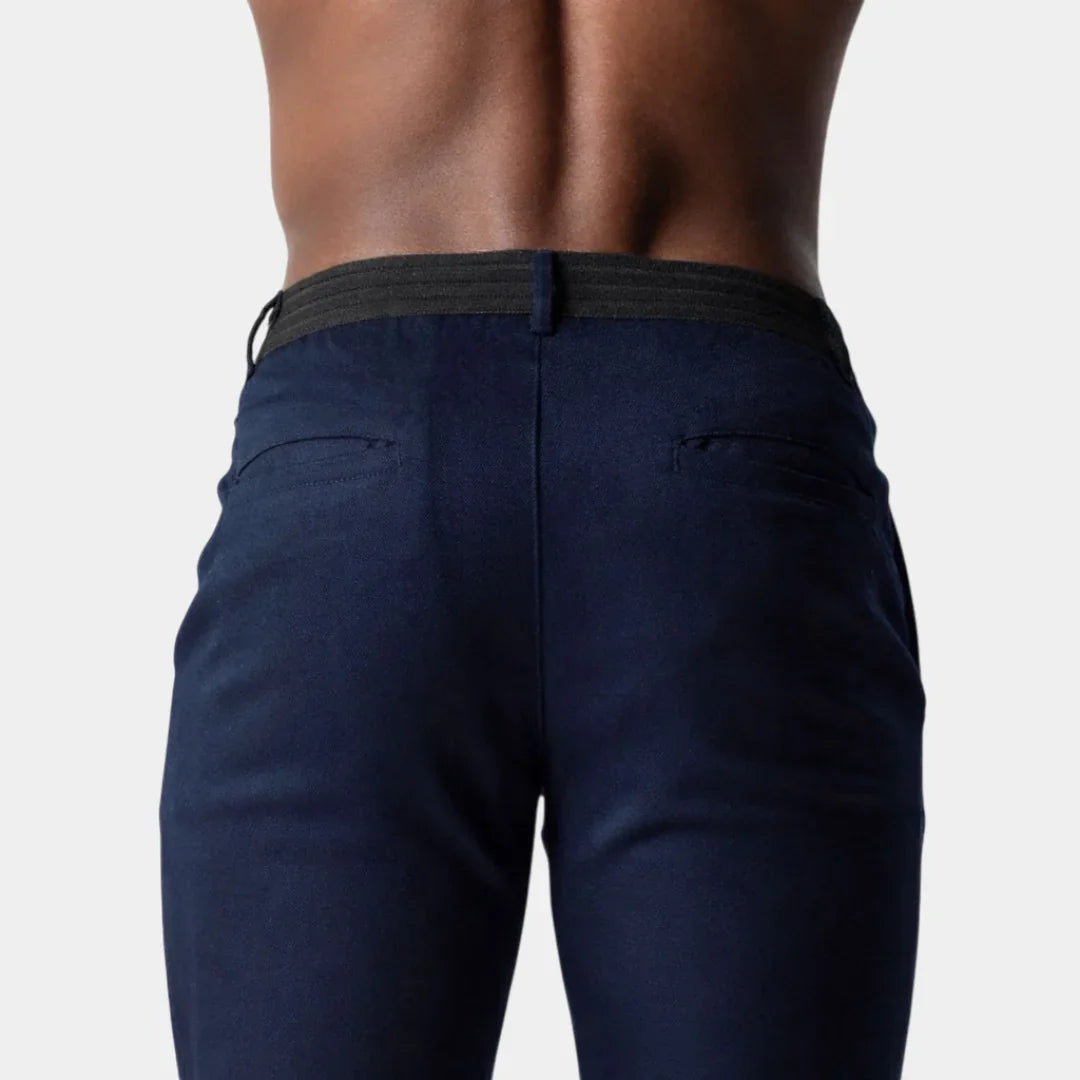Navy chino pants with waistband and belt loops, relaxed slim fit.