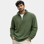 Military green ribbed quarter-zip sweater with long sleeves and half-button placket