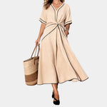 Beige V-neck spring dress with short sleeves, waist knot, and A-line midi skirt